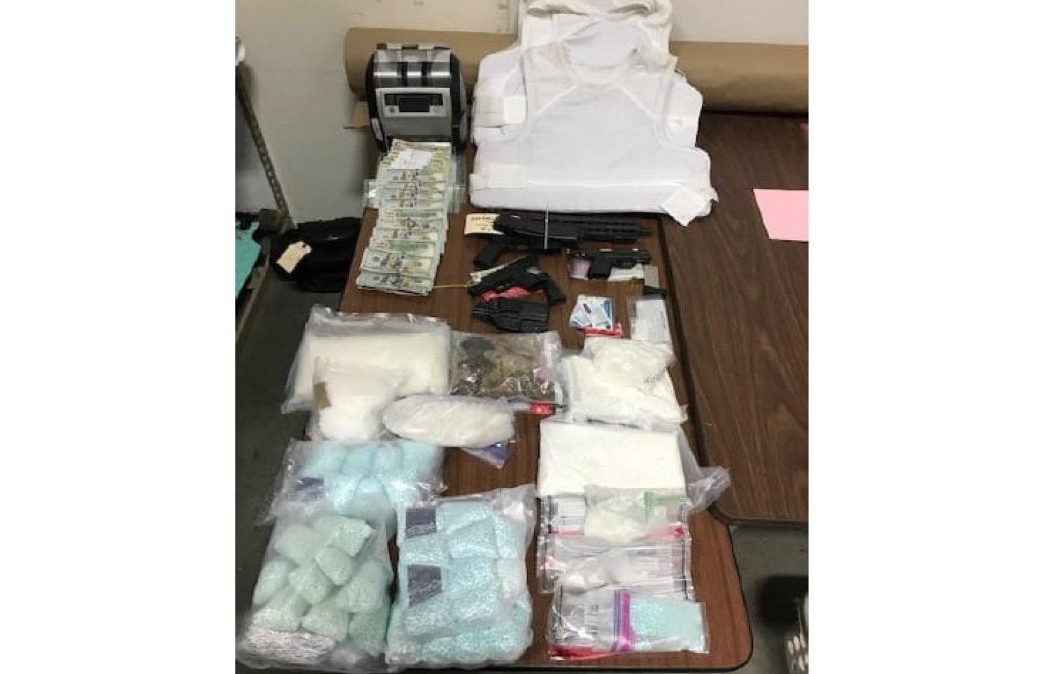 The search resulted in the seizure of 5.7 pounds of methamphetamine, 4.7 pounds of cocaine, 9.8 pounds of fentanyl, 2.3 pounds of heroin, three fully loaded firearms — one of which was stolen — three soft body armor vets and $90,000. The task force estimated the street value of the drugs at $1.2 million.